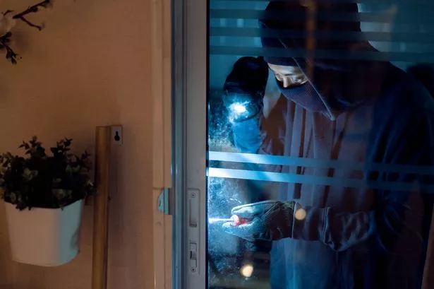 Burglar breaking into House