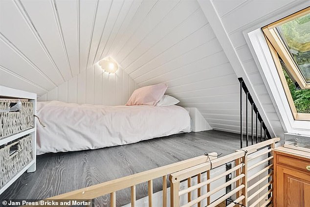 The bedroom has a bathroom leading off it, and there is another bed up a very steep spiral staircase, although the space is so small you cannot stand up