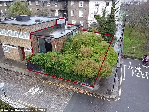 Despite its modest appearance, the end-of-terrace property is being sold at auction next month with a guide price of £925,000