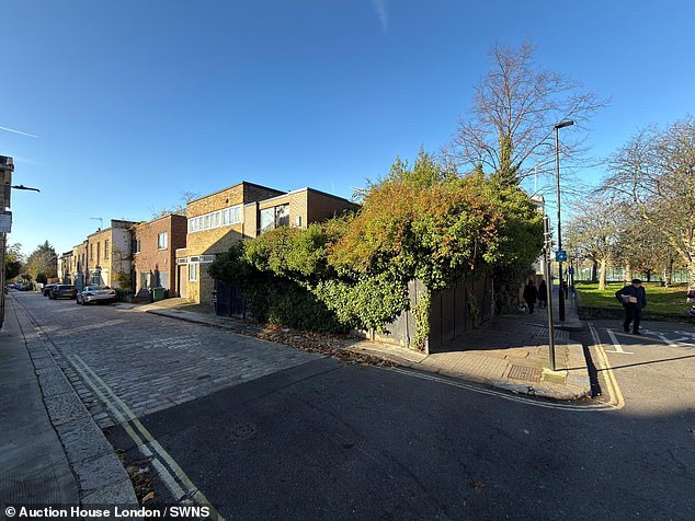 The outside of the rundown corner house is also completely overgrown with plants, as though reclaimed by nature after being left for years