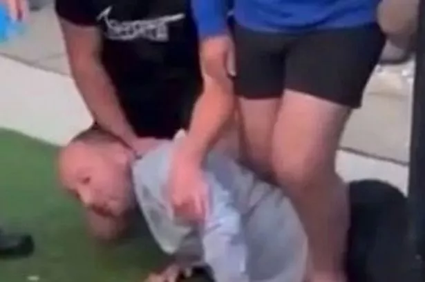 Naismith being held after he crashed his car