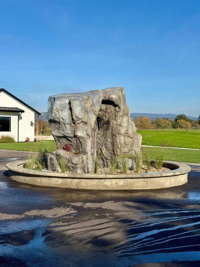 Driveway water feature is just about done. Decided to finish it off with a bunch of Muhly Grass that will make it look like the rock is emerging out of a hazy purple cloud once it fills in. All that’s left to do now is lighting and possibly acrylic stucco on the bench. Driveway water feature is just about done. Decided to finish it off with a bunch of Muhly Grass that will make it look like the rock is emerging out of a hazy purple cloud once it fills in. All that’s left to do now is lighting and possibly acrylic stucco on the bench.