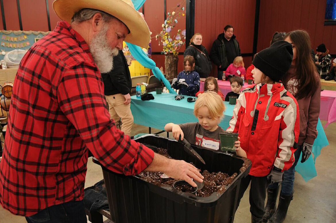 FILE - Gary Moran helps kids fill pots with soil during the free Lettuce Grow Together event at Fantasy Farms in Chilliwack on Saturday, March 22, 2025. (Jenna Hauck/ Chilliwack Progress file)