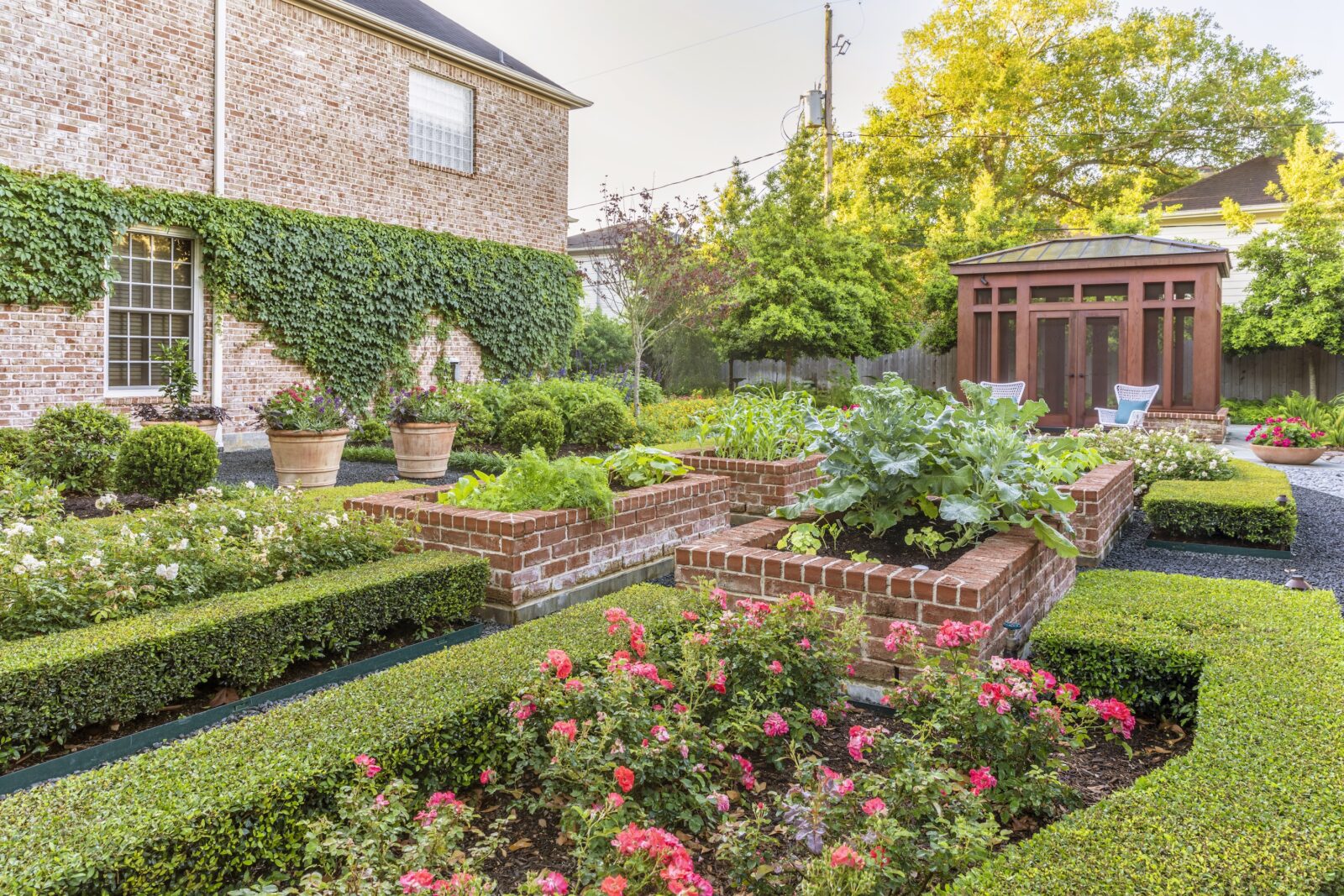 A garden with raised brick beds
