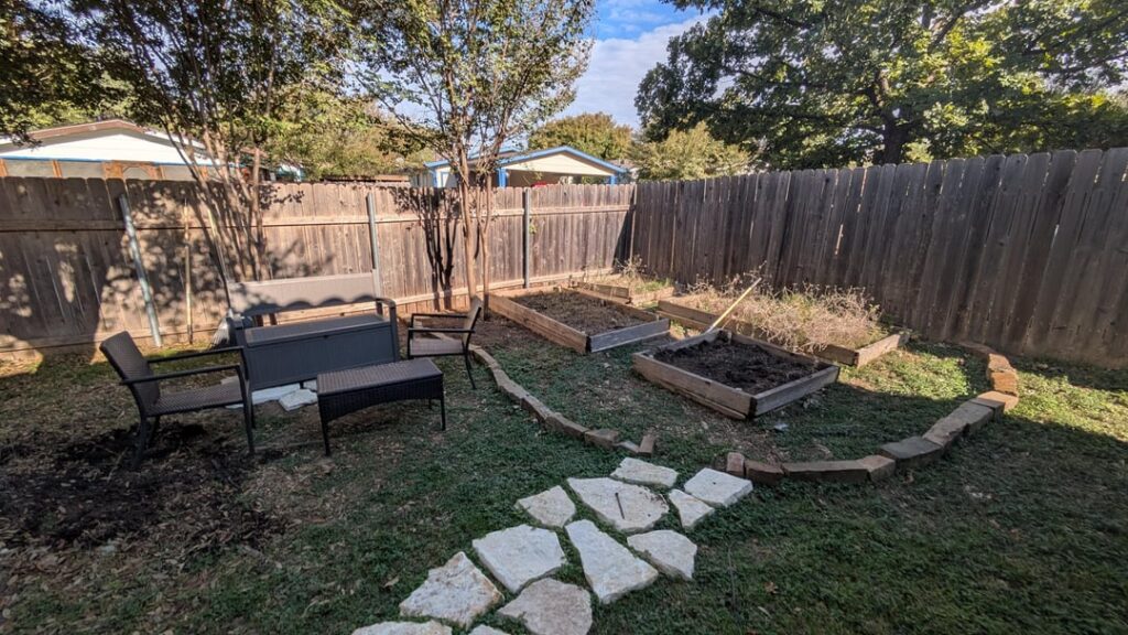 What to use on the ground in this seating/garden bed area?