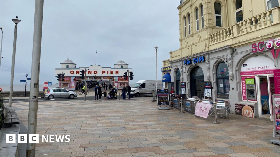 A view of the outside of the restaurant with the pier in the background. The restaurant doesn't have any seating outside of it anymore.