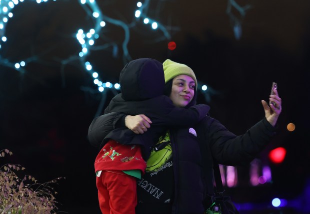 Jen Alfaro takes pictures with her son, Jonny, 4, at...