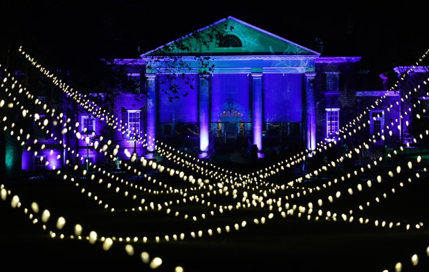 The McCormick House is lit for the holidays during the...