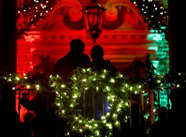 A couple takes in the exterior of the McCormick House...