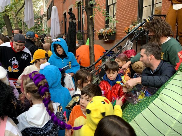 Tons of candy were distributed in the Halloween feeding frenzy on Garden Place. Photo: Mary Frost, Brooklyn Eagle