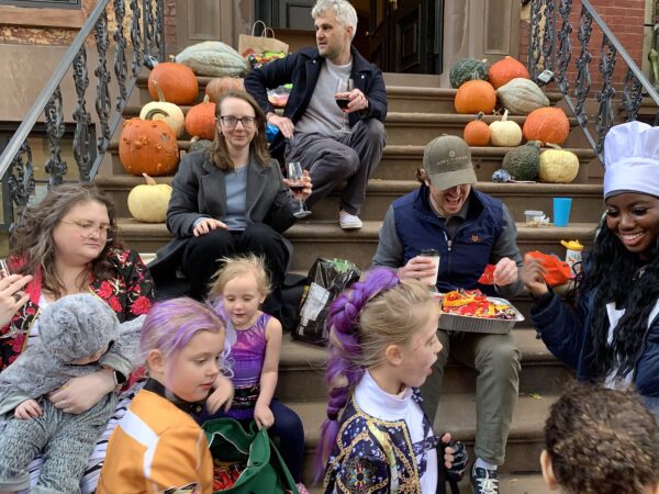 These Garden Place residents have reached the “red wine” phase of the festivities. Photo: Mary Frost, Brooklyn Eagle