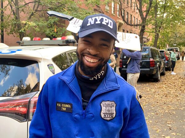 NYPD Community Affairs Officer Wallace Council gets into the fun with some new headgear. Photo: Mary Frost, Brooklyn Eagle