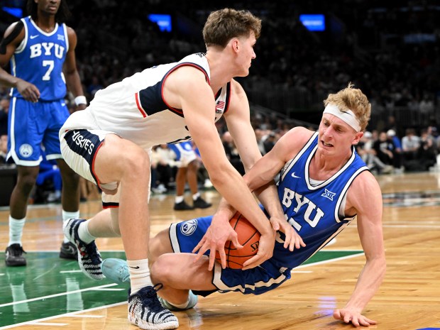 Eric Reibe #12 of the UConn Huskies and Richie Saunders #15 of the BYU Cougars battle for the ball during the first half at the TD Garden on Nov. 15, 2025 in Boston, Massachusetts. (Photo by Brian Fluharty/Getty Images)