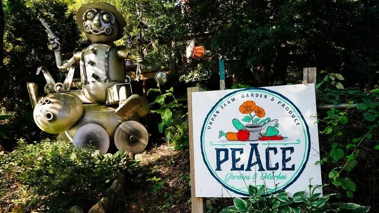 Metal art installation and Peace Gardens sign