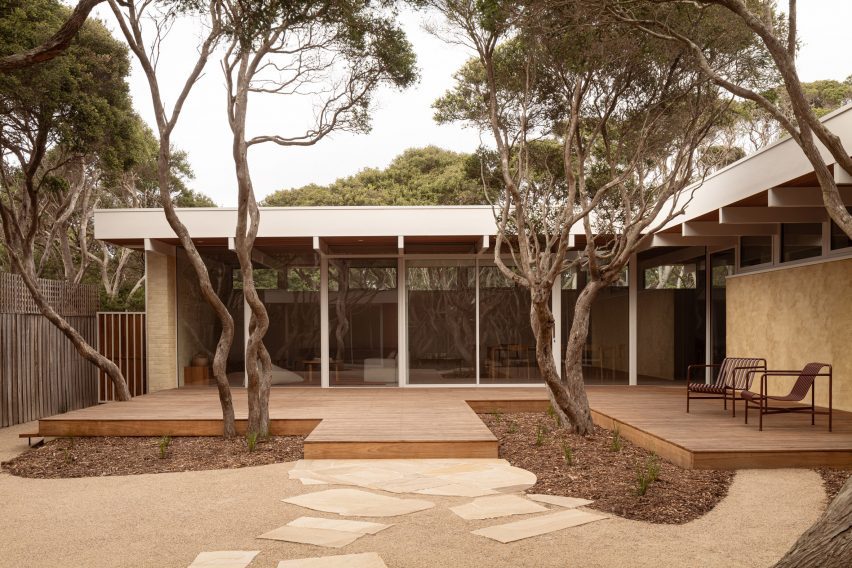 L-shaped house with large windows