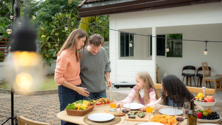 A family gathering outside for Thanksgiving