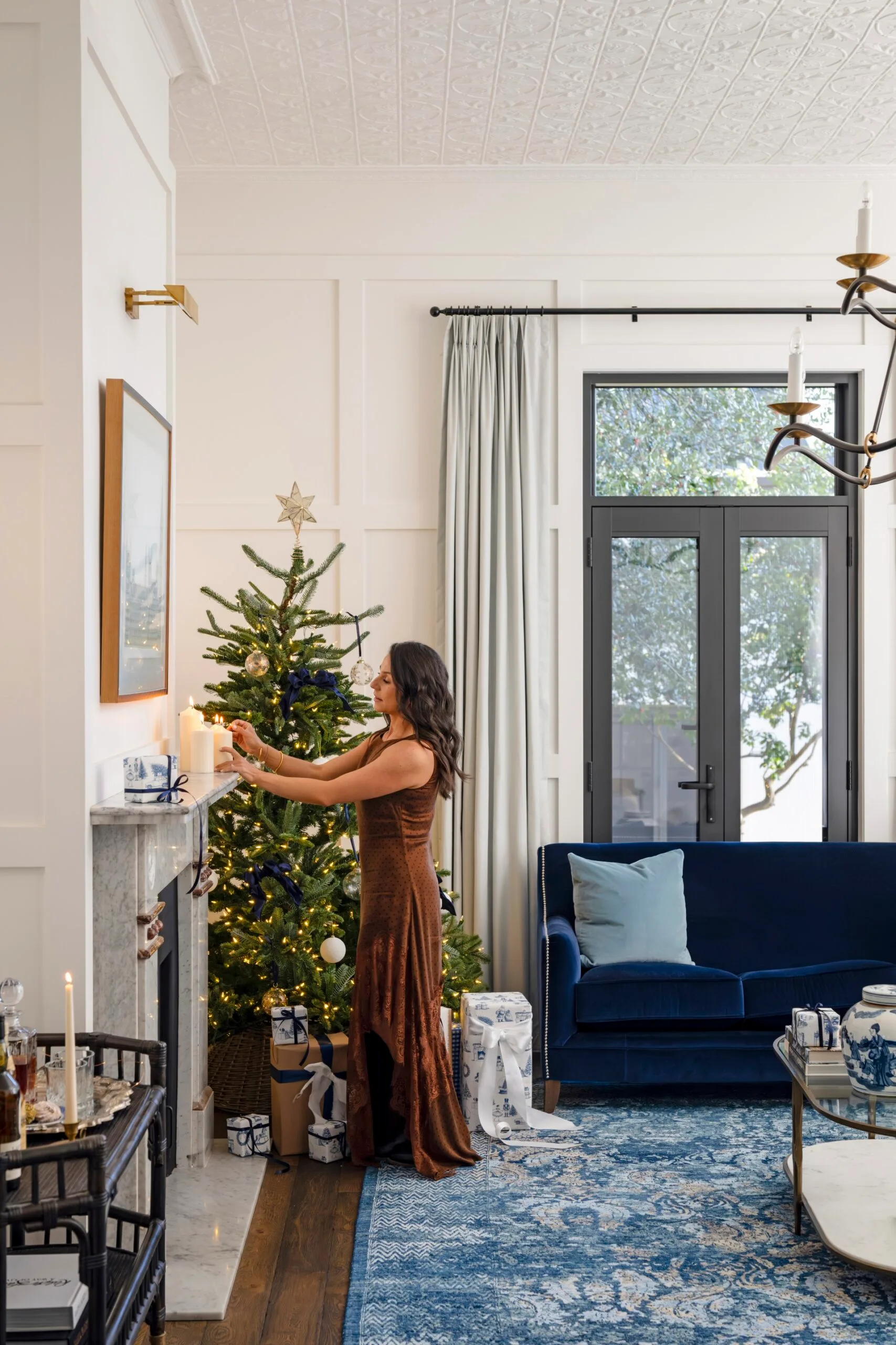Maree styling her marble mantel in a formal lounge room
