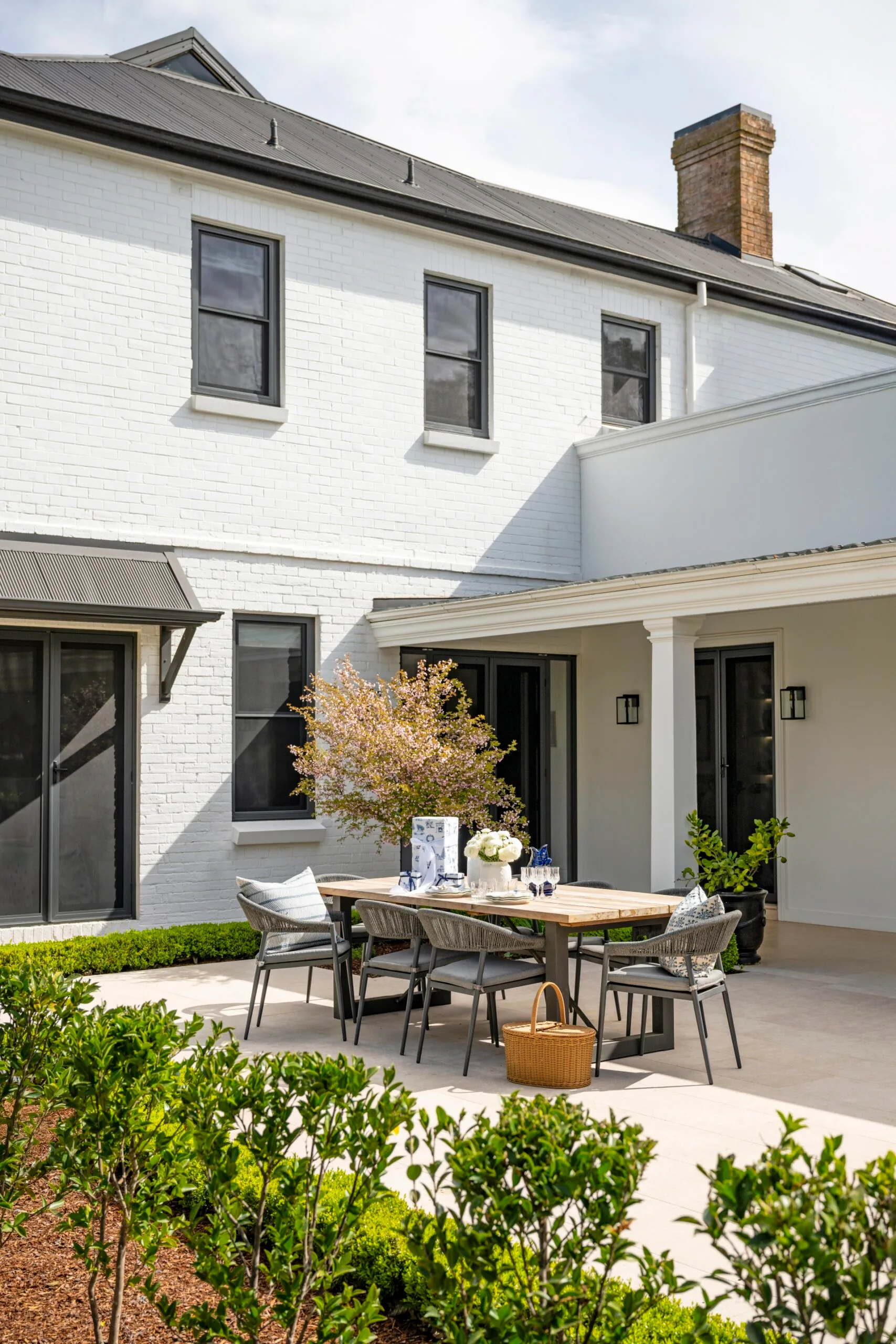 An alfresco space with a timber dining setting