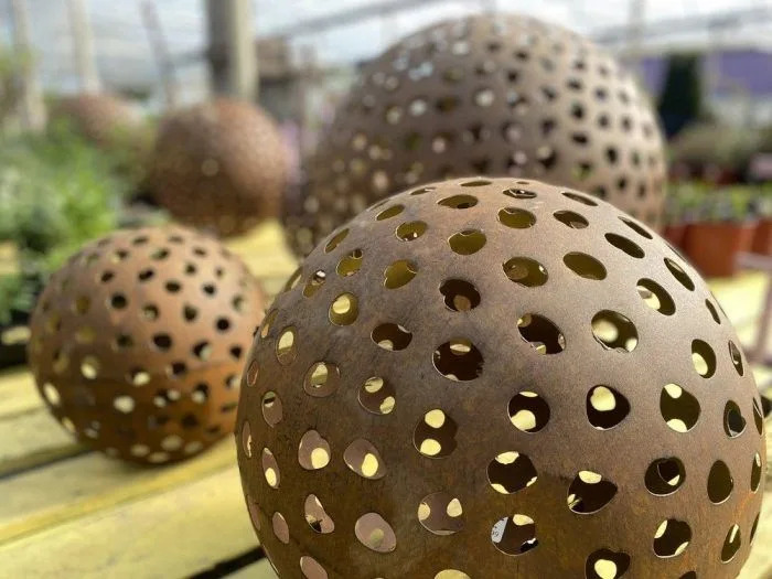 A well-placed piece of garden art will immediately elevate the look of their garden. Minter Country Garden photo