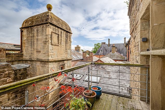 The property has two balconies - one of each of the upper floors - both of which are accessible by the bedrooms on their respective floors
