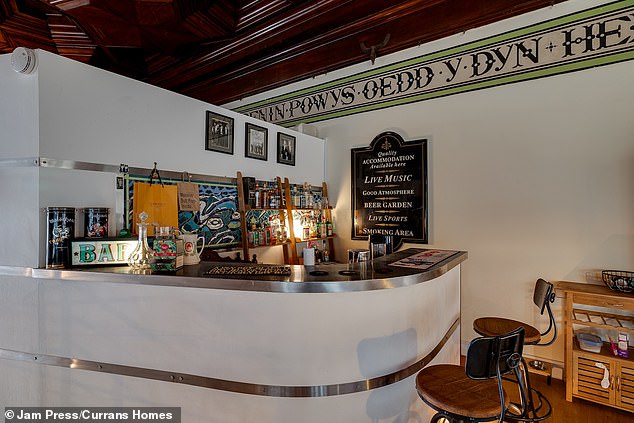 The cinema room also features its own bar, the perfect space to entertain guests