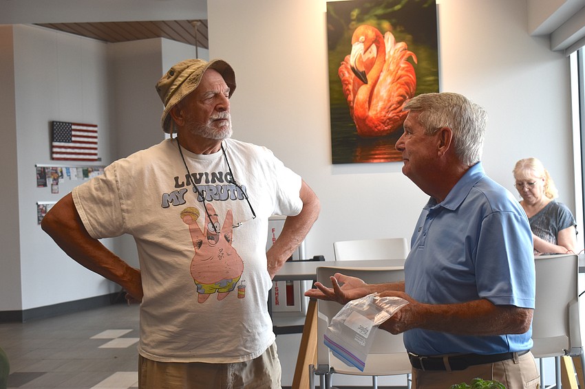 Parrish's Larry Maas attended the mobile plant clinic to understand why his citrus tree is deteriorating and got a 