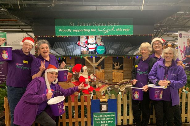 Fern Centre volunteers and St John’s Garden Centre staff at the unveiling of this year’s Santa Band display.
(Credit: Royal Devon Hospitals Charity)