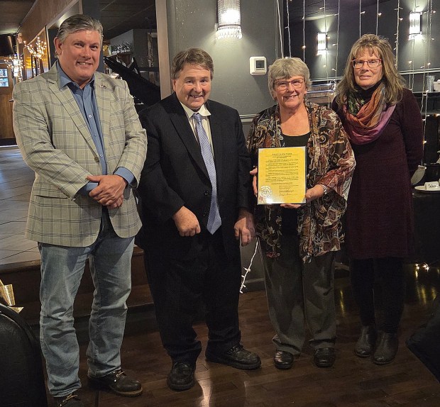 Schuylkill County Commissioners Larry Padora, left, and Gary Hess present proclamation to Carol Haldeman and Kim Morgan on 85th anniversary of the South Schuylkill Garden Club on Dec. 3, 2025. RON DEVLIN/STAFF PHOTO