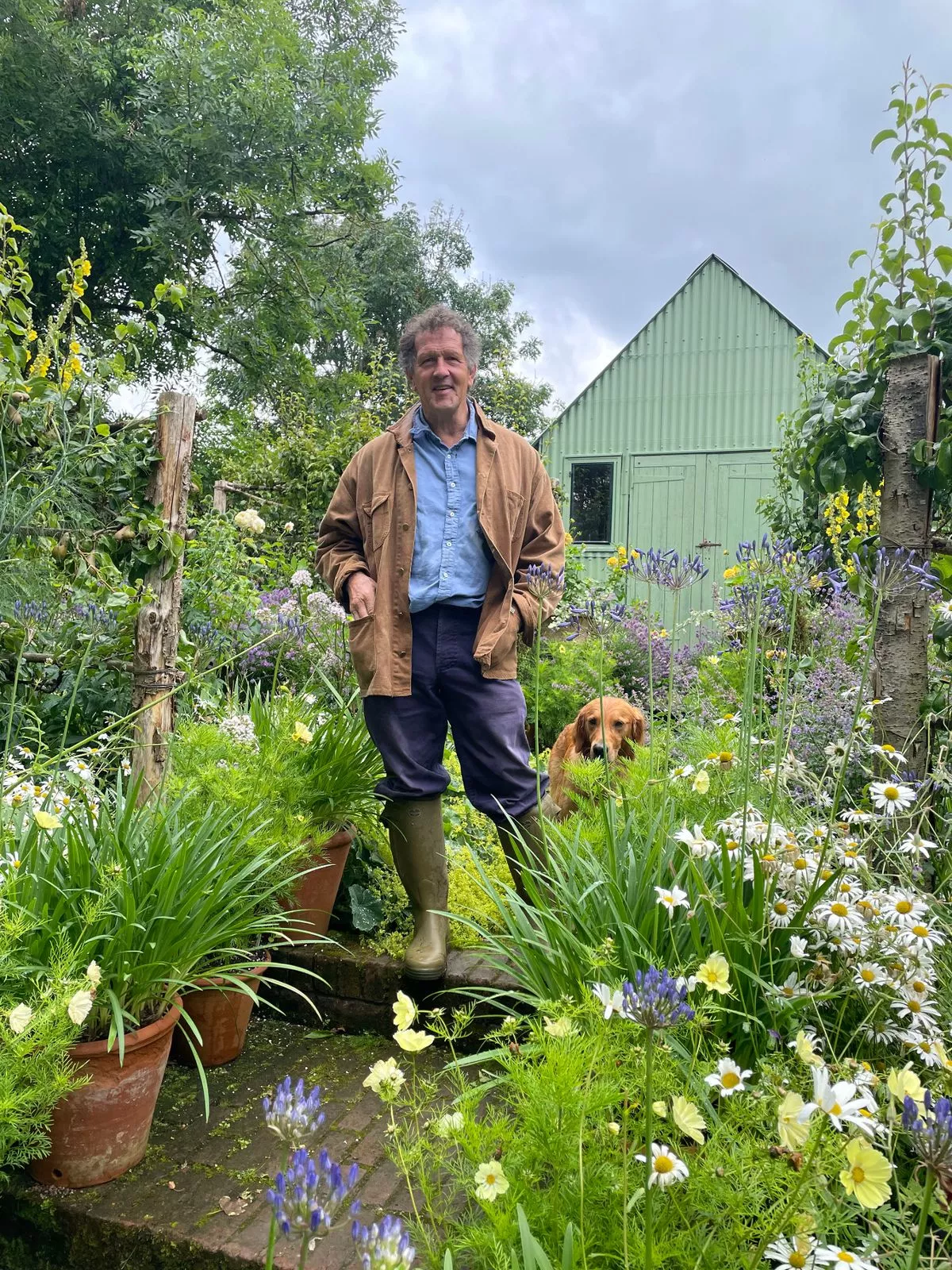 Monty Don with his dog Ned on the Mound at Longmeadow