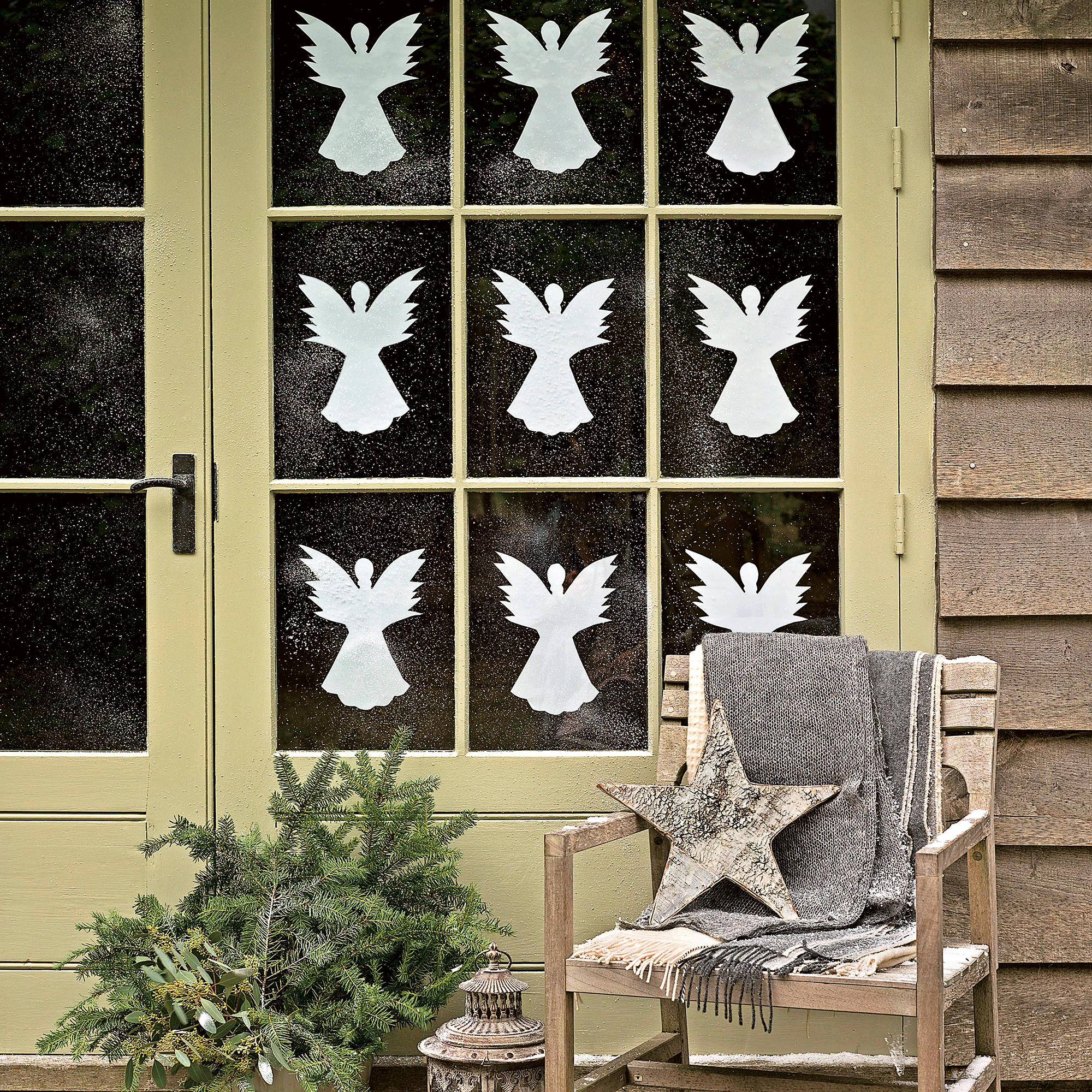 Christmas window with paper angels