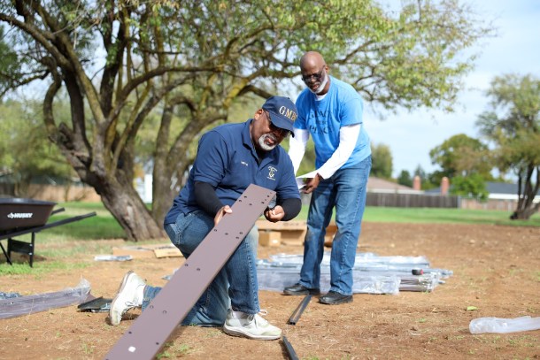 The Bible speaks of reaping what you sow, planting gardens and eating what you produce, suggesting that growing one’s own food is a cornerstone of a stable, long-term life. Grace Missionary Baptist Church volunteer Walter Lomax, left, and Pastor Gordon Thomas set up planters at the church as an extension of a senior gardening program. Douglas Carter, OBSERVER