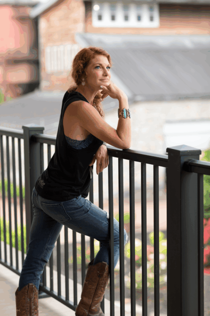 A Peek Inside the Lauded Distillery – Garden & Gun A portrait of a woman against a railing