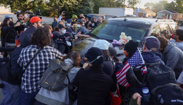 Protesters surround a federal SUV and try and prevent it from driving to the U.S. Immigration and Customs Enforcement facility in Broadview on Sept. 26, 2025. (Stacey Wescott/Chicago Tribune)