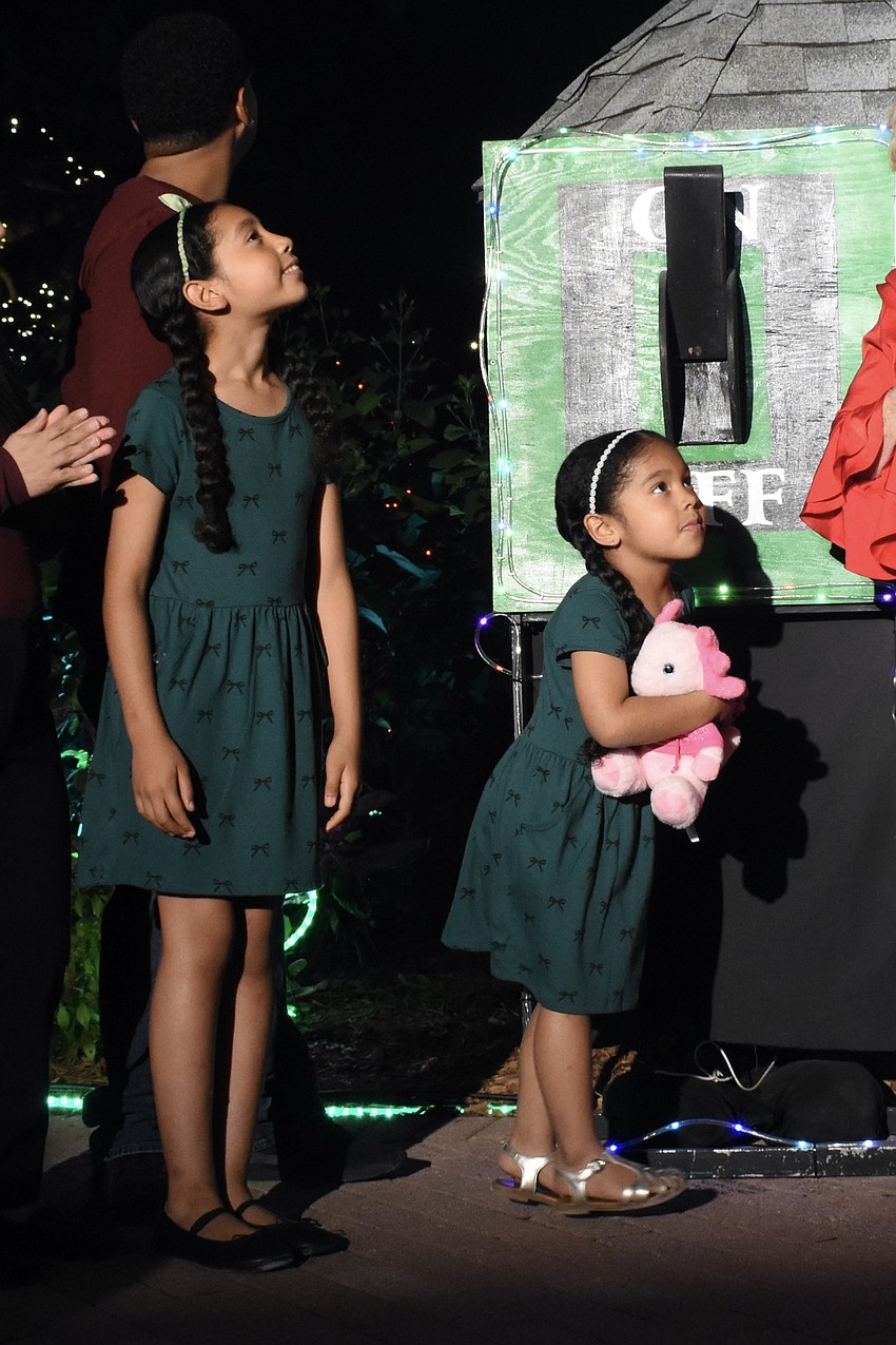 Nadia Pinckney, 9, and Alani Pinckney, 5, look around at the display.