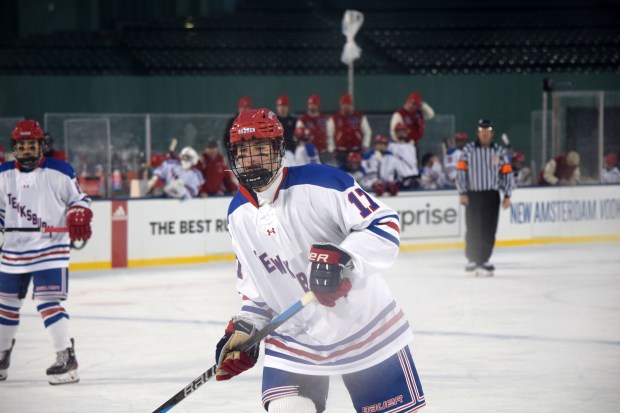 Tewksbury High's Jackson Feudo skates on the ice at Fenway Park during an exhibition game against a New Jersey team. (Courtesy photo)