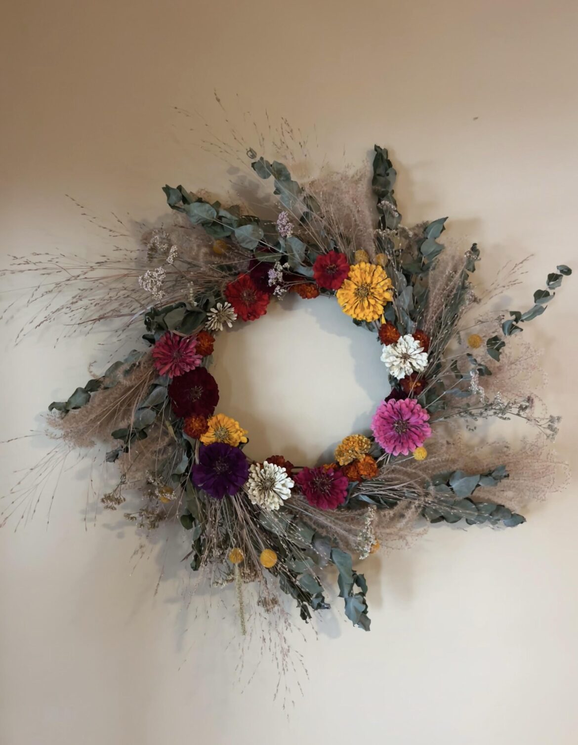 I made my first wreath using flowers and plants I grew and dried throughout the year. The base is made from willow branches I foraged from my parents’ yard