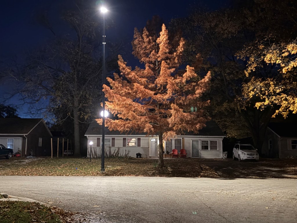 Yard lights in the Garden Hills neighborhood illuminate the street. The City of Champaign's SLEEP program added hundreds of lights to the Garden Hills neighborhood between 2022 and 2023. Photo by Mike Rock.