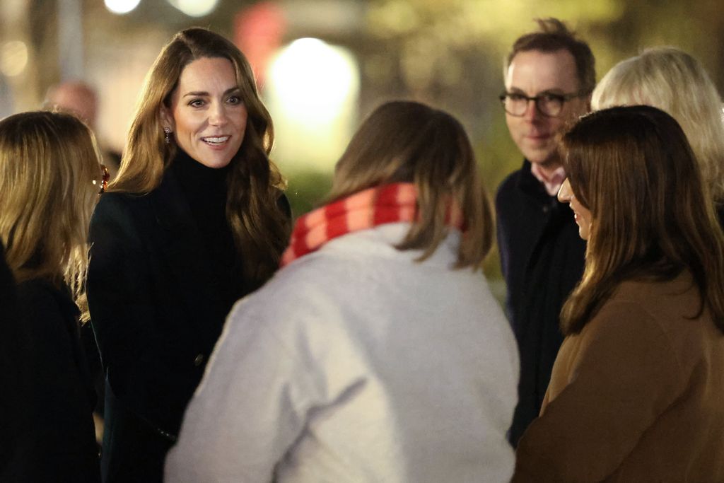 Kate Middleton talking to a crowd of people