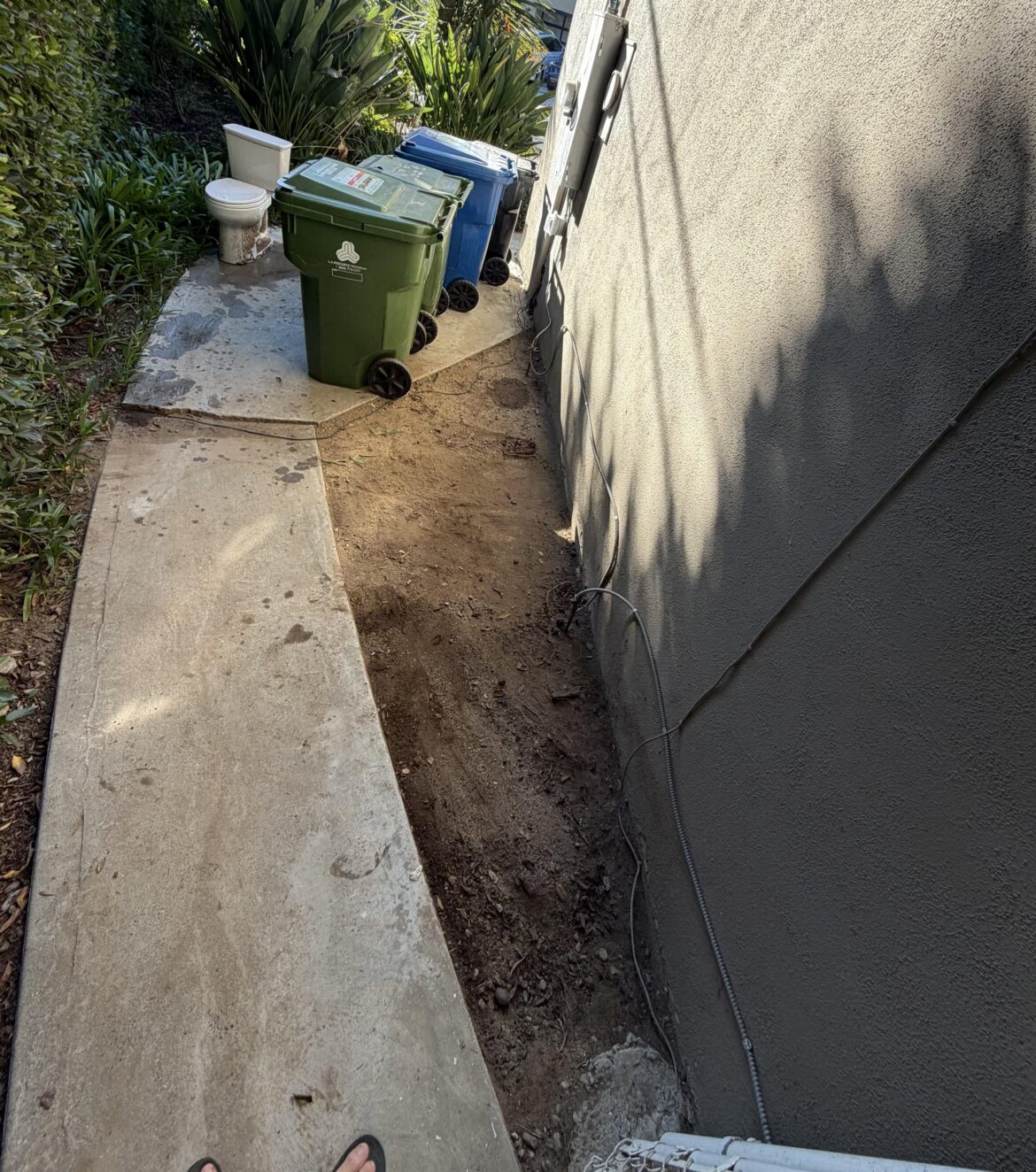 Cutting curved pavers vs cement vs crushed rock for area in between concrete pathway and house? Cutting curved pavers vs cement vs crushed rock for area in between concrete pathway and house?