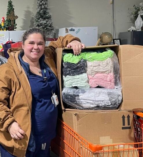 St. Elizabeth associates donate 5,400 pairs of socks to Rose Garden Home mission St. Elizabeth associates donate 5,400 pairs of socks to Rose Garden Home mission
