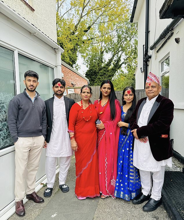 Rom Panday (far right) and his family, who have lived in their Greenwich home for over years are now battling their council