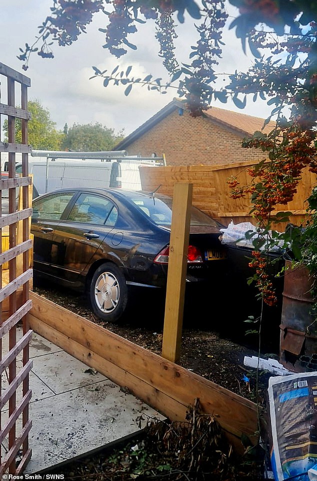 Mrs Smith took pictures when she found her fence had been torn down by her neighbour, she said