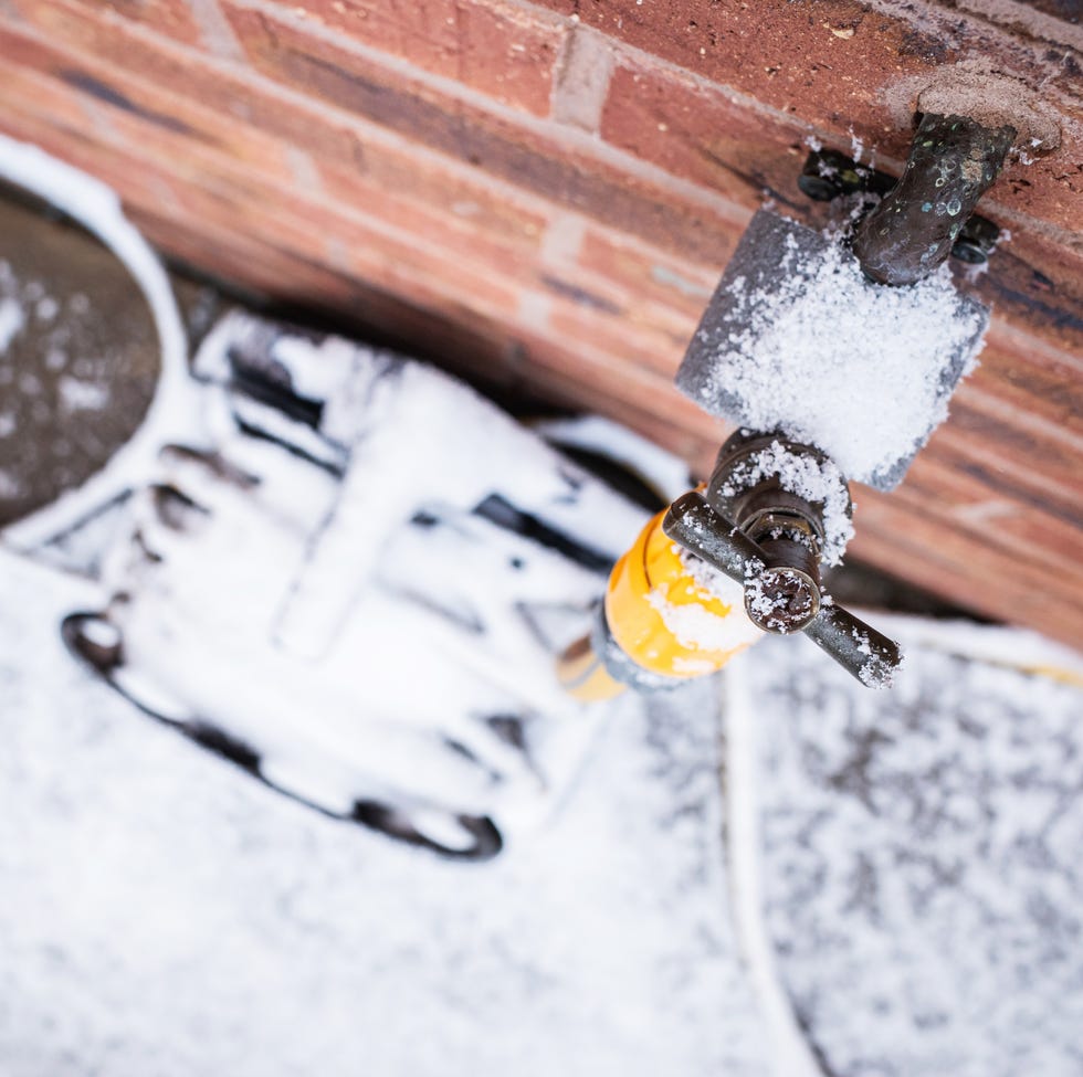 outside tap and hosepipe reel in winter