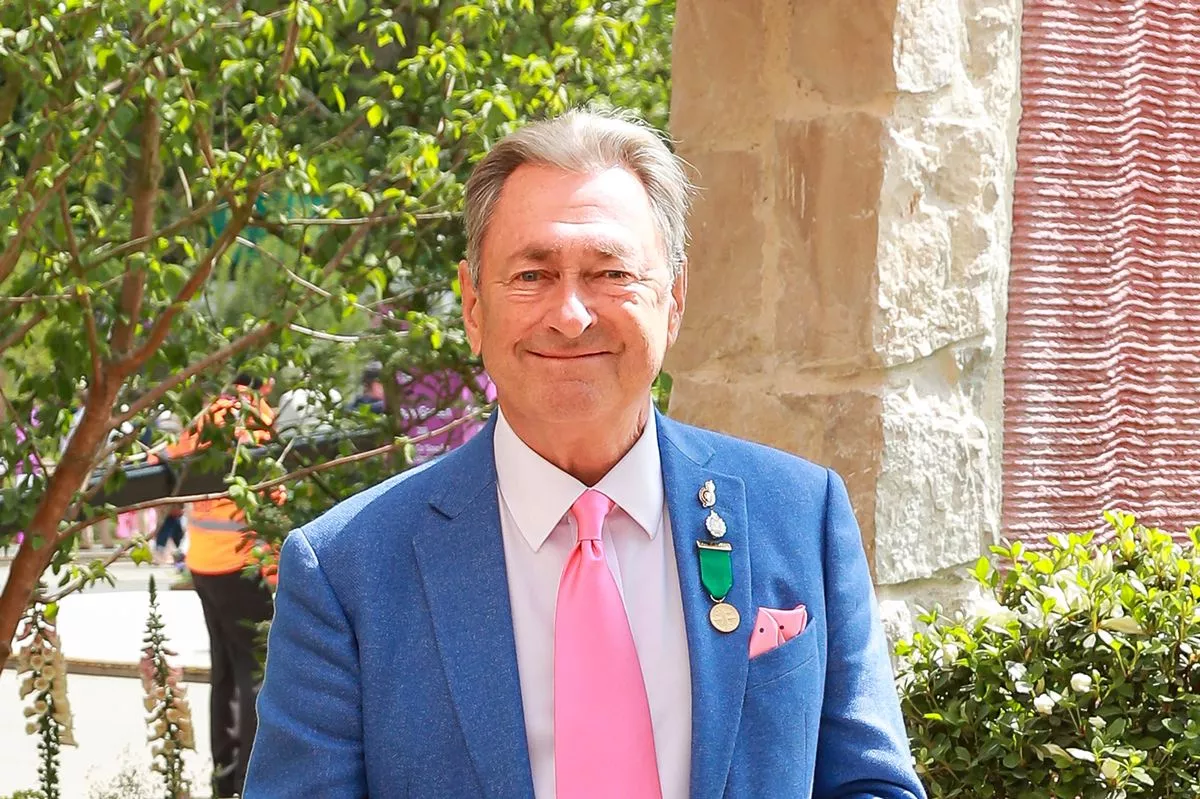 Alan Titchmarsh walks through the Killik & Co 'Save for a Rainy Day' Garden at Chelsea Flower Show on May 19, 2025 in London, England.