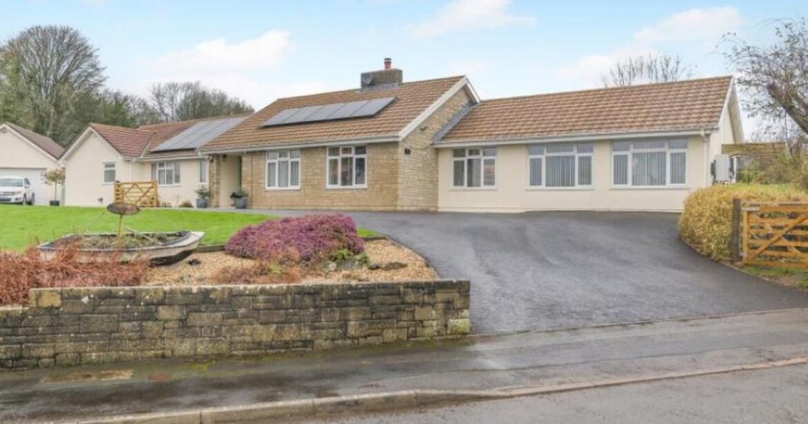 Landscaped half-acre gardens with five-bed executive home