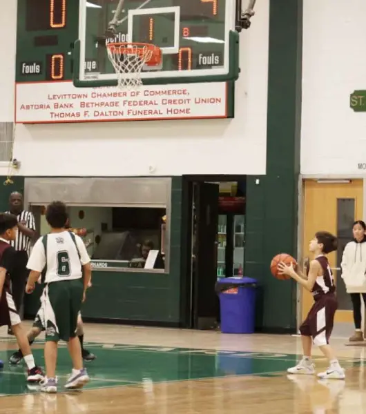 Emmett Walker (14) setting up to score a 2-pointer.