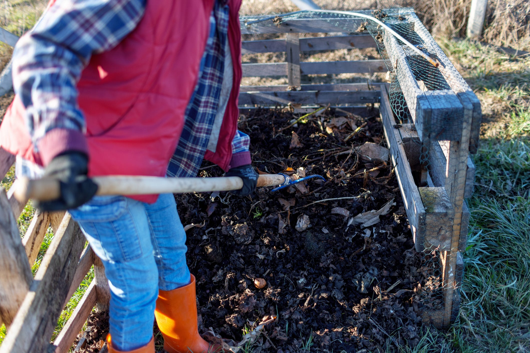 Turning A Pile Of Compost