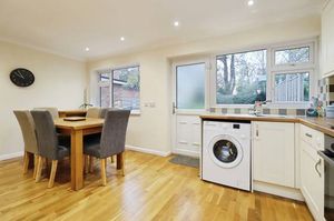 Fitted kitchen and dining area with ample storage and workspace, ideal for shared meals and socialising.
