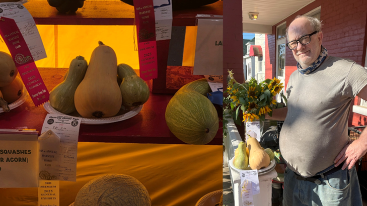 A man smiles next to a squash display at a fair. The table shows various squashes with winner ribbons. Bright autumn sunlight enhances the scene.