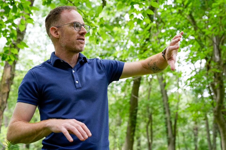 Jason Taylor, Bur Oak Land Trust executive director, speaks about conservation at the Muddy Creek Preserve July 17, 2025 in Coralville, Iowa.
